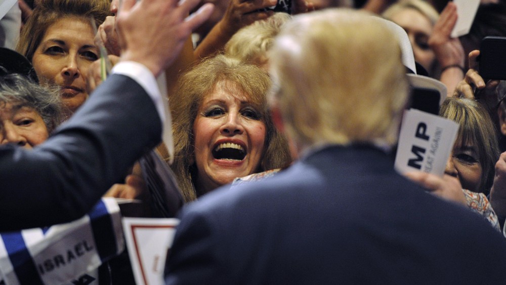A woman gets an autograph from Donald Trump after he spoke at a campaign rally South Point Resort and Casino in Las Vegas, Nev., Jan. 21, 2016. (Photo by David Becker/Reuters)