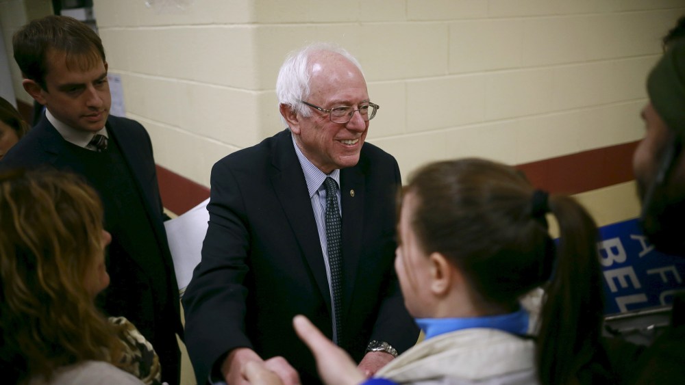 U.S. Democratic presidential candidate Senator Bernie Sanders shakes hands with an attendee during a campaign town hall meeting in Bedford, N.H. Jan. 22, 2016. (Photo by Katherine Taylor/Reuters)