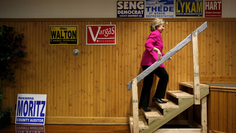 Democratic U.S. presidential candidate Hillary Clinton takes the stage to speak during the Scott County Democratic Party's Red, White and Blue Dinner at the Mississippi Valley Fairgrounds in Davenport, Ia., Jan. 23, 2016. (Photo by Scott Morgan/Reuters)