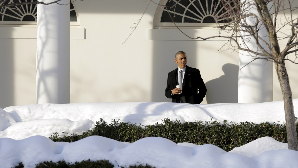 U.S. President Barack Obama waits for members of his staff in the Colonnade as he walks to the Oval Office at the White House in Washington Jan. 25, 2016. (Photo by Joshua Roberts/Reuters)