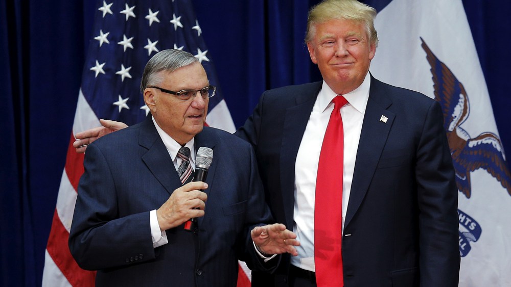 Republican presidential candidate Donald Trump is joined onstage by Maricopa County Sheriff Joe Arpaio at a campaign rally in Marshalltown, Iowa, Jan. 26, 2016. (Photo by Brian Snyder/Reuters)