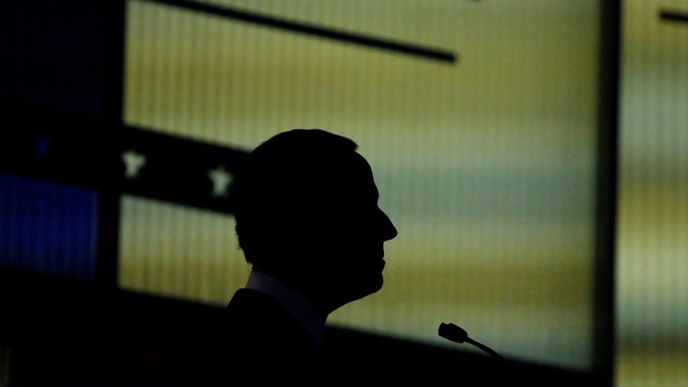 Republican presidential candidate and former Senator Rick Santorum is silhouetted against the backdrop during the undercard debate held by Fox News in Des Moines, Iowa, Jan. 28, 2016. (Photo by Carlos Barria/Reuters)