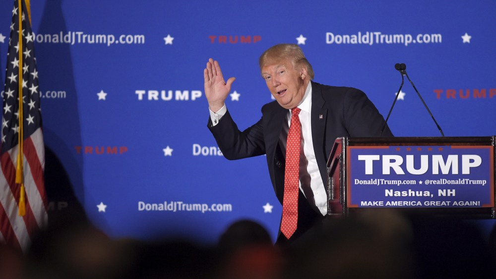 U.S. Republican presidential candidate Donald Trump pantomimes a candidate with low poll numbers as he address the audience at a campaign rally in Nashua, N.H., Jan. 29, 2016. (Photo by Gretchen Ertl/Reuters)
