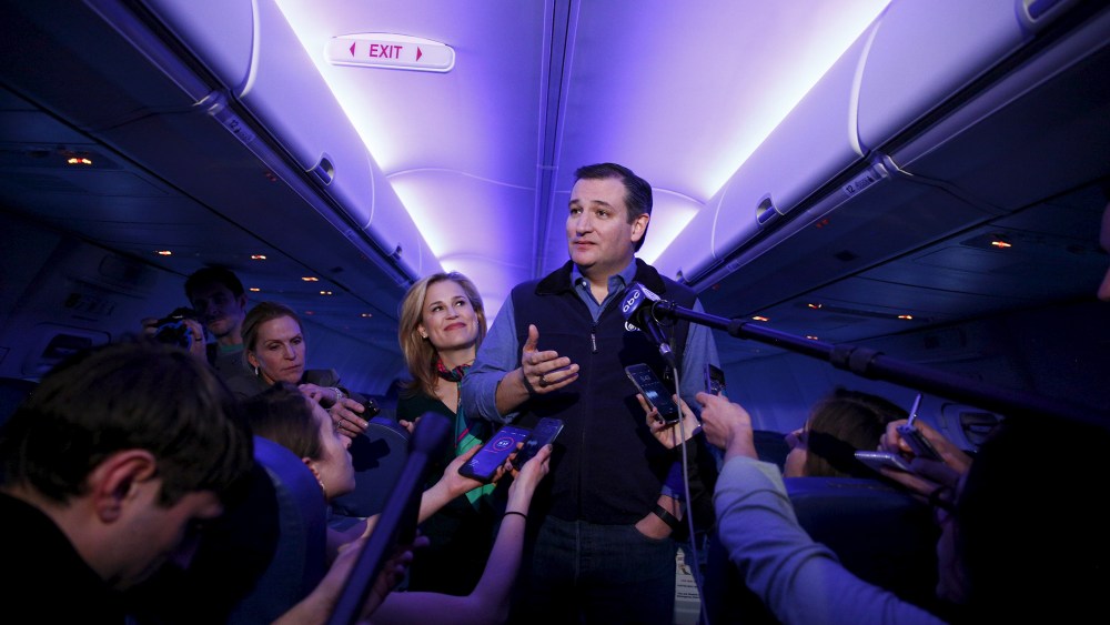 U.S. Republican presidential candidate Ted Cruz and his wife Heidi speak to the press aboard a plane en route to a campaign event in Piedmont, S.C., Feb. 2, 2016. (Photo by Eric Thayer/Reuters)