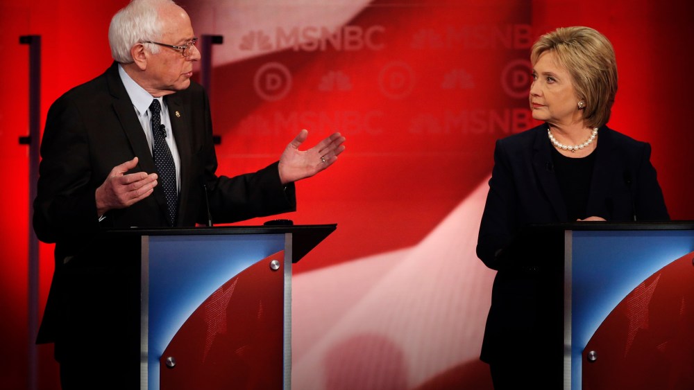 Bernie Sanders speaks as Hillary Clinton looks on as they discuss issues during the MSNBC Democratic debate at the University of New Hampshire in Durham, N.H., Feb. 4, 2016. (Photo by Mike Segar/Reuters)