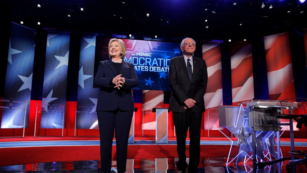 Democratic presidential candidates Hillary Clinton and Bernie Sanders on stage before the start of the Democratic presidential debate sponsored by MSNBC at the University of New Hampshire in Durham, N.H., Feb. 4, 2016. (Photo by Carlo Allegri/Reuters)