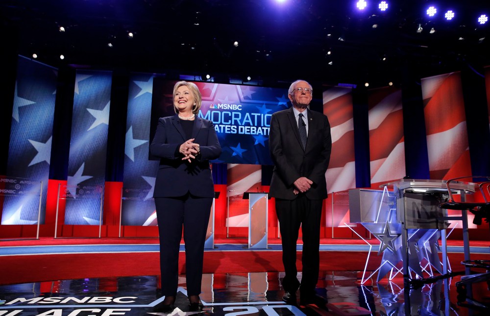 Democratic presidential candidates Hillary Clinton and Bernie Sanders on stage before the start of the Democratic presidential debate sponsored by MSNBC at the University of New Hampshire in Durham, N.H., Feb. 4, 2016. (Photo by Carlo Allegri/Reuters)