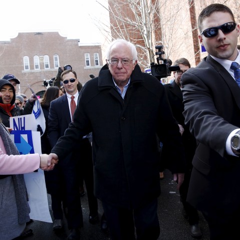 Bernie Sanders shakes hands with voters outside a polling place in Concord, N.H., Feb. 9, 2016. (Photo by Shannon Stapleton/Reuters)