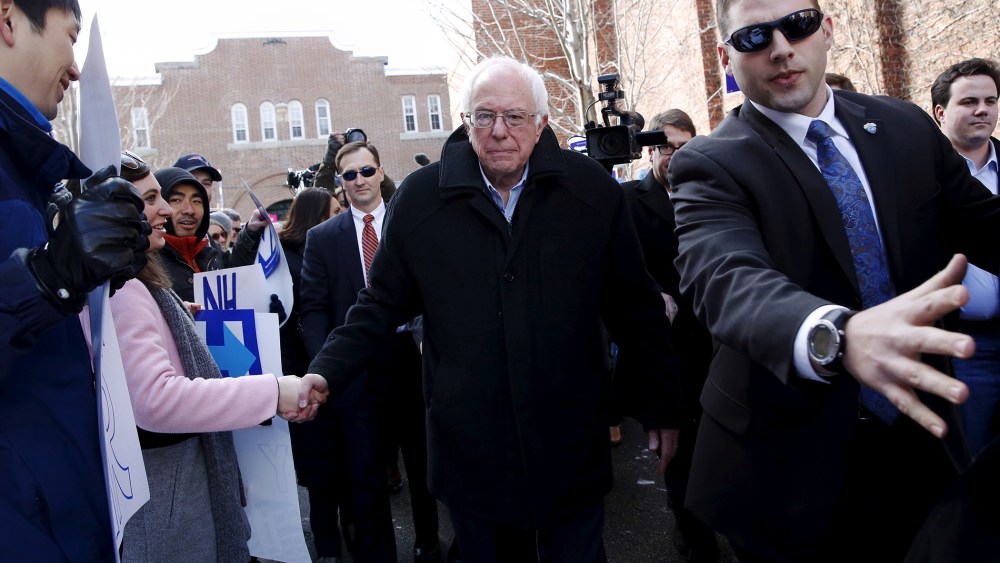Bernie Sanders shakes hands with voters outside a polling place in Concord, N.H., Feb. 9, 2016. (Photo by Shannon Stapleton/Reuters)