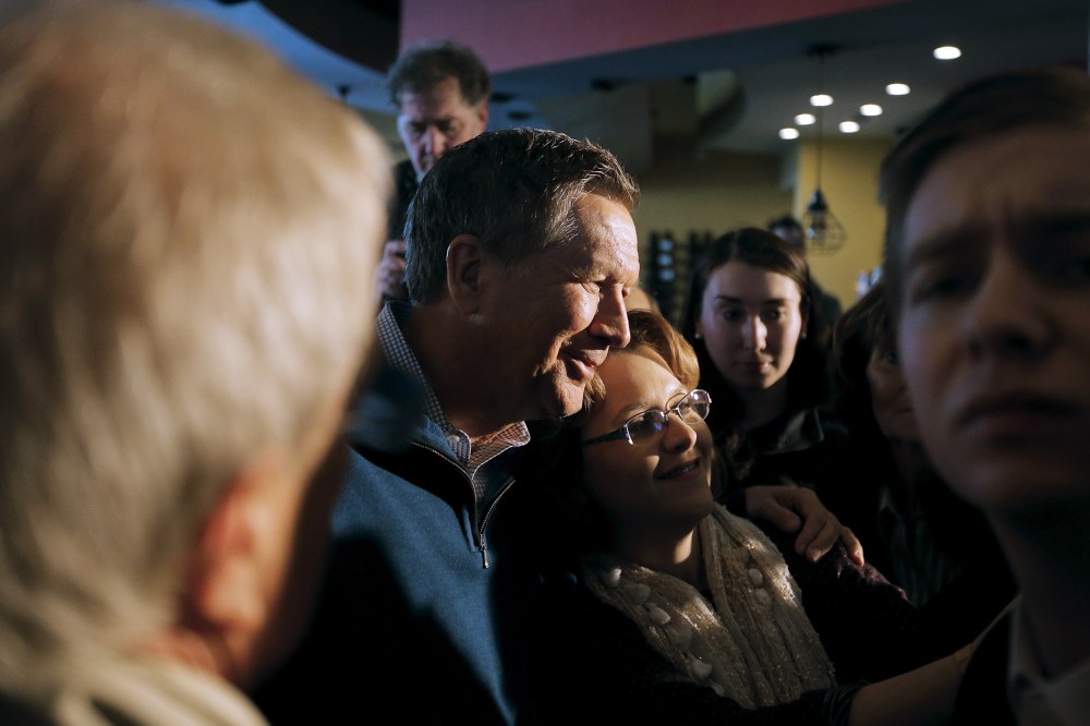 John Kasich poses for a picture with a supporter during a campaign event in Mount Pleasant, S.C., Feb. 10, 2016. (Photo by Chris Keane/Reuters)