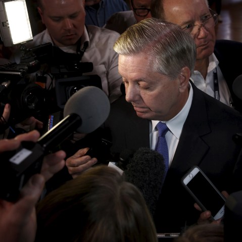 Senator Lindsey Graham is surrounded by reporters outside a Republican presidential candidates debate in Greenville, S.C., Feb. 13, 2016. (Photo by Jonathan Ernst/Reuters)