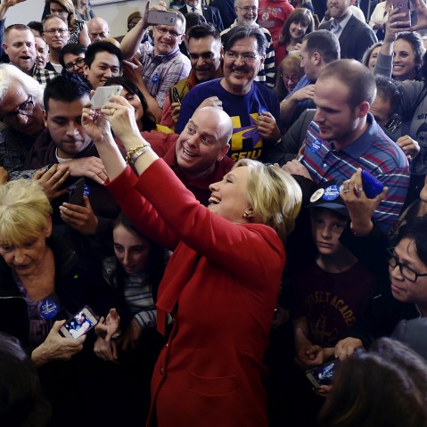 Democratic presidential candidate Hillary Clinton takes a selfie with supporters after speaking at a campaign rally in Las Vegas, Nev., Feb. 14, 2016. (Photo by David Becker/Reuters)