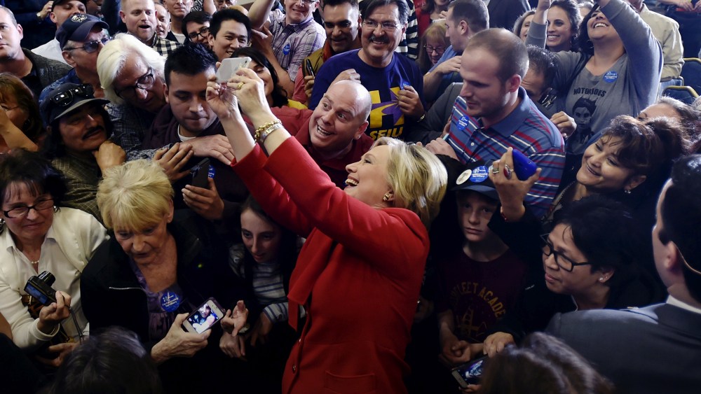 Democratic presidential candidate Hillary Clinton takes a selfie with supporters after speaking at a campaign rally in Las Vegas, Nev., Feb. 14, 2016. (Photo by David Becker/Reuters)