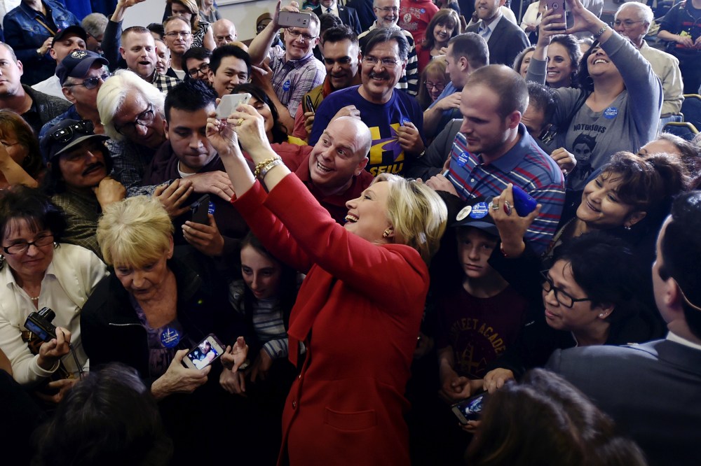 Democratic presidential candidate Hillary Clinton takes a selfie with supporters after speaking at a campaign rally in Las Vegas, Nev., Feb. 14, 2016. (Photo by David Becker/Reuters)
