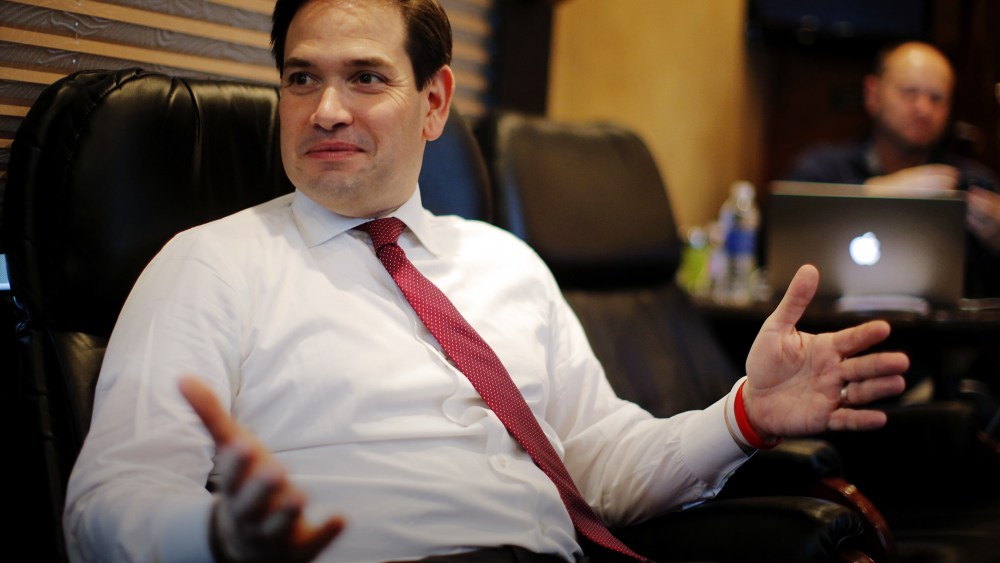 Republican presidential candidate Marco Rubio speaks with members of the media on his campaign bus between stops in S.C., Feb. 15, 2016. (Photo by Chris Keane/Reuters)