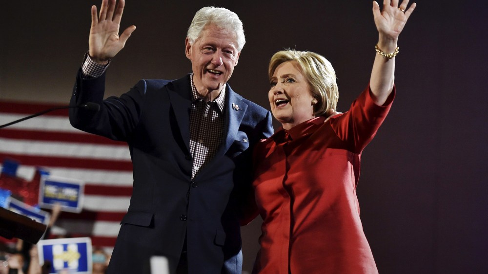 Democratic presidential candidate Hillary Clinton and her husband former President Bill Clinton wave to supporters in Las Vegas, Nev., Feb. 20, 2016. (Photo by David Becker/Reuters)
