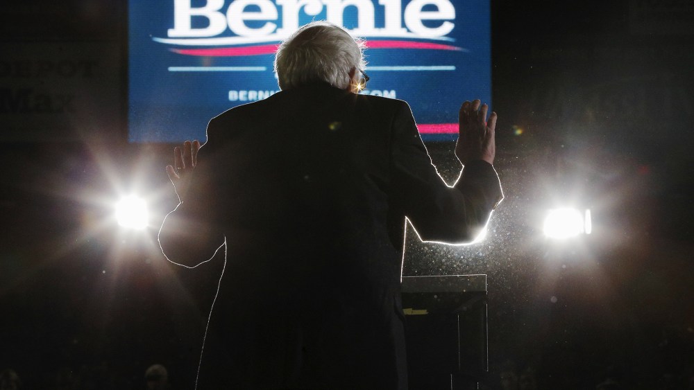 Democratic presidential candidate and Senator Bernie Sanders is silhouetted as he speaks at a campaign rally at UMass Amherst in Amherst, Mass., Feb. 22, 2016. (Photo by Brian Snyder/Reuters)