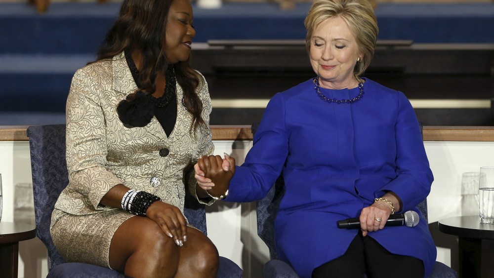 Sybrina Fulton (L), mother of shooting victim Trayvon Martin, endorses U.S. Democratic presidential candidate Hillary Clinton during a town hall meeting at Central Baptist Church in Columbia, S.C., on Feb. 23, 2016. (Photo by Jonathan Ernst/Reuters)