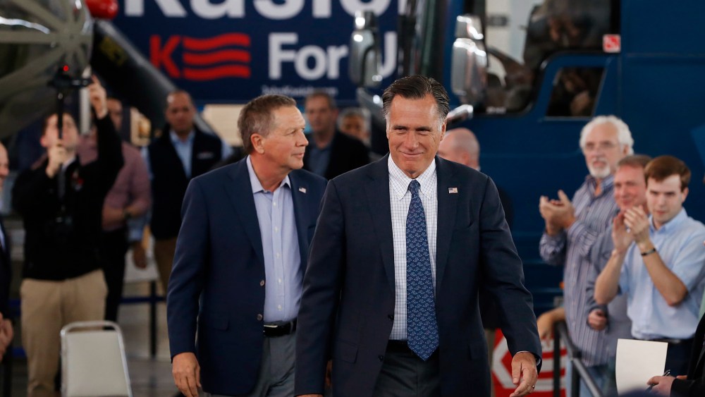 Former Republican U.S. presidential nominee Mitt Romney arrives with current Republican presidential candidate John Kasich inside the MAPS Air Museum for a Kasich campaign rally in North Canton, Ohio, March 14, 2016. (Photo by Aaron P. Bernstein/Reuters)
