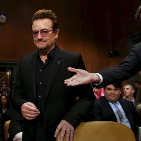 Deputy Secretary of State Antony Blinken welcomes U2 lead singer Bono to testify before a Senate subcommittee hearing on Capitol Hill in Washington, April 12, 2016. (Photo by Yuri Gripas/Reuters)