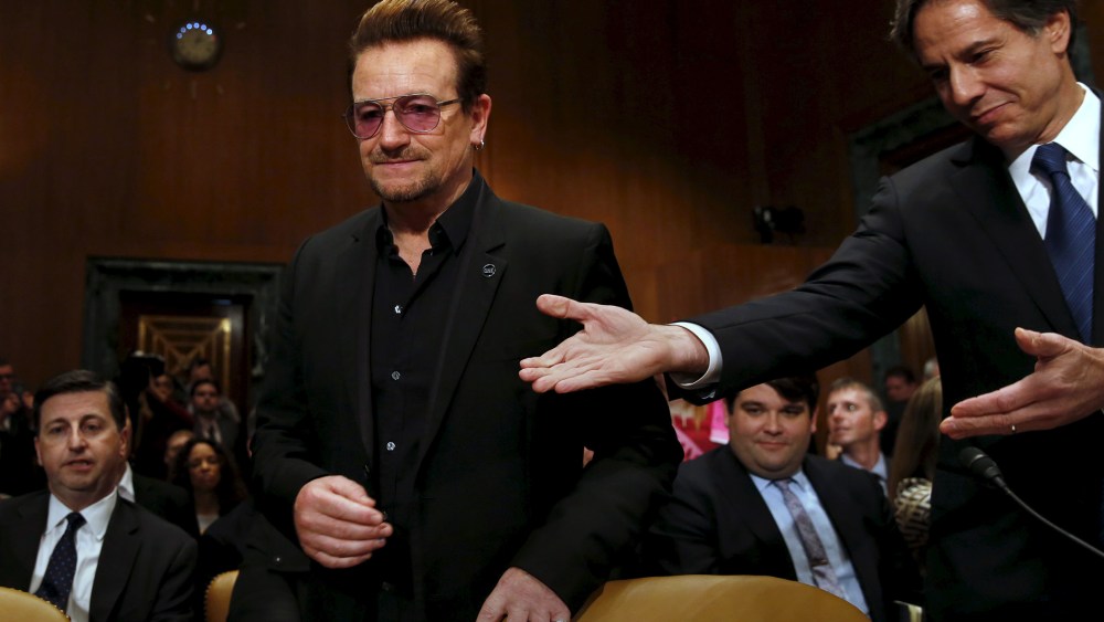 Deputy Secretary of State Antony Blinken welcomes U2 lead singer Bono to testify before a Senate subcommittee hearing on Capitol Hill in Washington, April 12, 2016. (Photo by Yuri Gripas/Reuters)