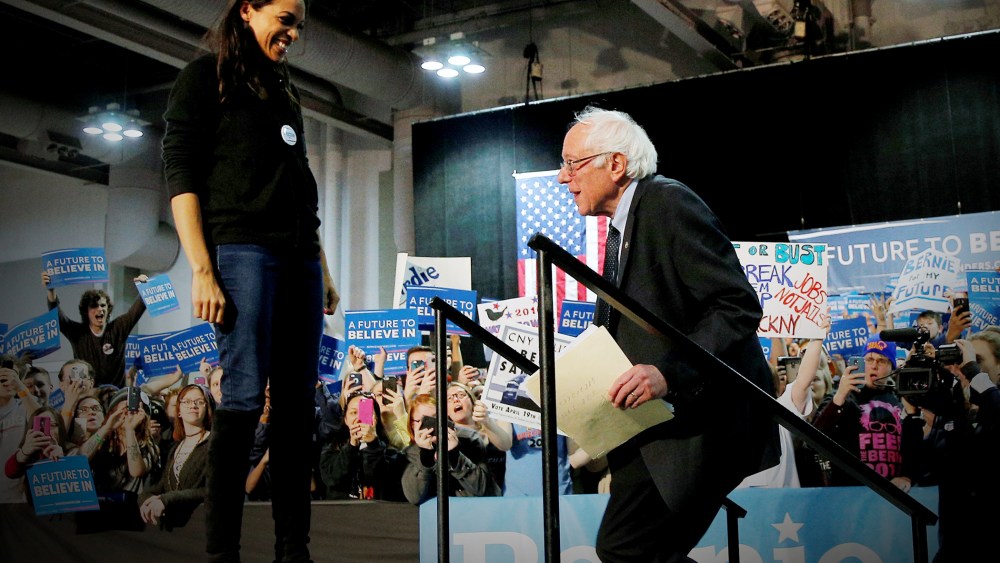 Actress Rosario Dawson welcomes U.S. Democratic presidential candidate and Senator Bernie Sanders to the stage at a campaign rally in Syracuse, N.Y., April 12, 2016. (Photo by Brian Snyder/Reuters)