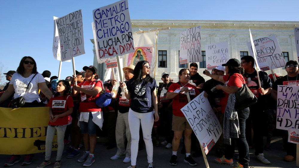 Immigration activists rally outside the U.S. Supreme Court as justices hear arguments on immigration in Washington April 18, 2016. (Photo by Joshua Roberts/Reuters)