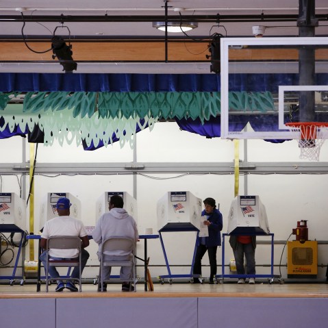 Voters use booths located on the stage at the polling center at the James Weldon Johnson Community Center during the New York primary elections in East Harlem, New York City, April 19, 2016. (Photo by Andrew Kelly/Reuters)