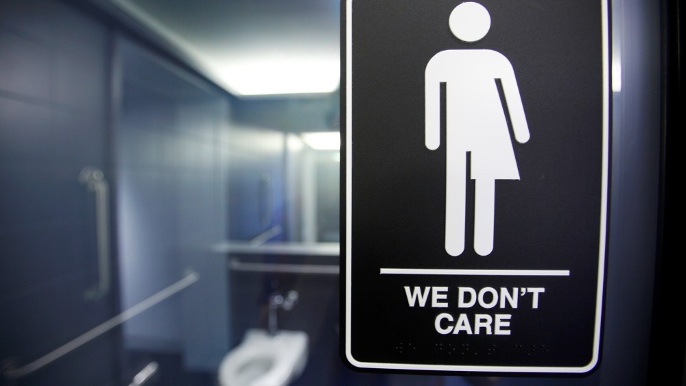 A sign protesting a recent North Carolina law restricting transgender bathroom access adorns the bathroom stalls at the 21C Museum Hotel in Durham, N.C., May 3, 2016. (Photo by Jonathan Drake/Reuters)