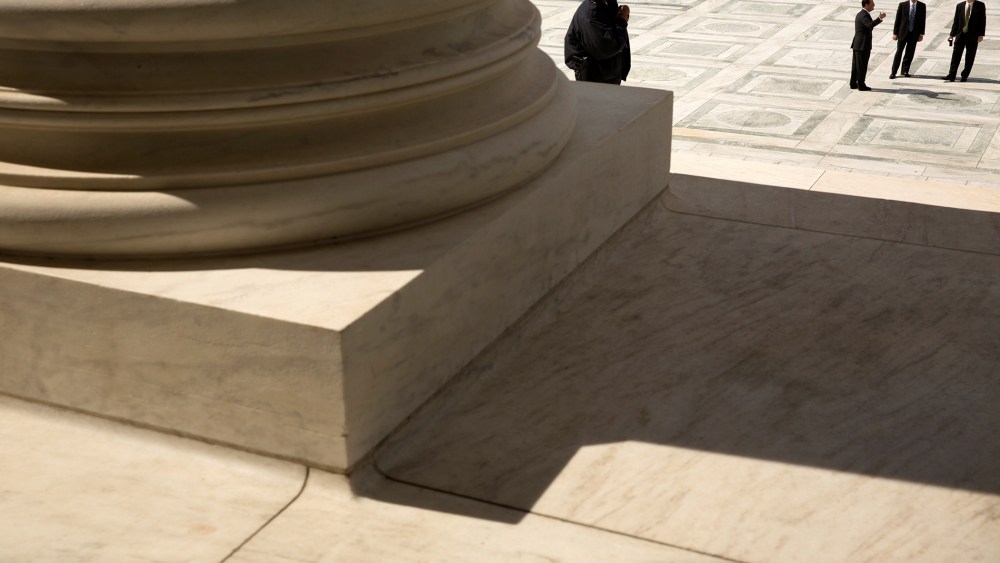 A guard stands on the steps of the U.S. Supreme Court building in Washington, Oct. 5, 2015. (Photo by Jonathan Ernst/Reuters)