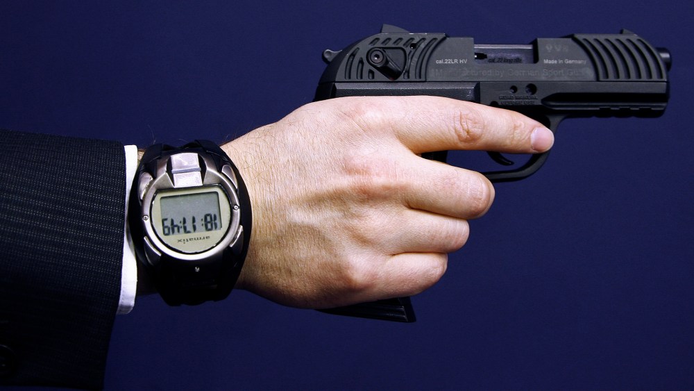 A man holds a prototype of a smart gun by Armatix during the International Guns Exhibition Nuremberg, March 13, 2009.
