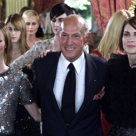 US designer Oscar de la Renta arrives at the end of the presentation of French fashion house Balmain..