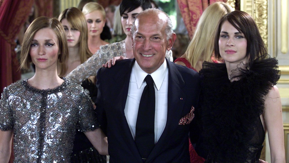US designer Oscar de la Renta arrives at the end of the presentation of French fashion house Balmain..