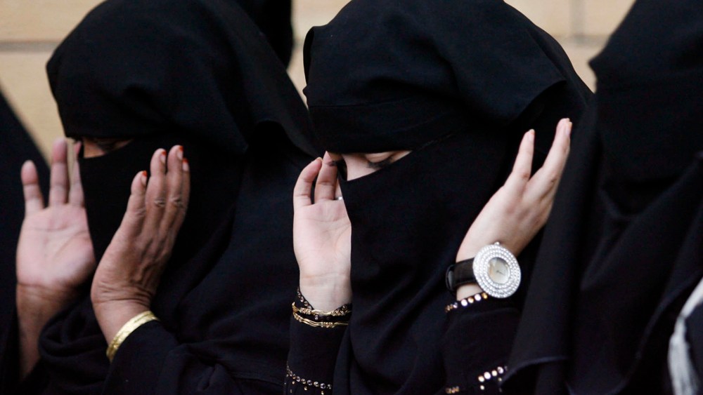 Saudi women pray during Eid al-Adha celebrations on a street in Riyadh, Nov. 27, 2009. (Photo by Stringer/Reuters)