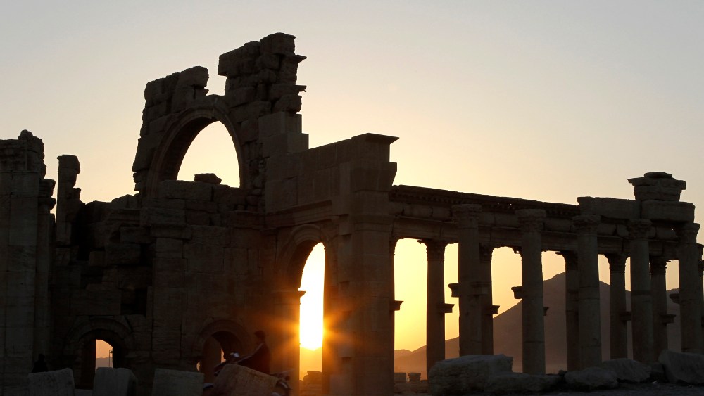 The sun sets behind ruined columns at the historical city of Palmyra, in the Syrian desert, some 240 km (150 miles) northeast the capital of Damascus, Nov. 12, 2010. (Photo by Khaled al-Hariri/Reuters)