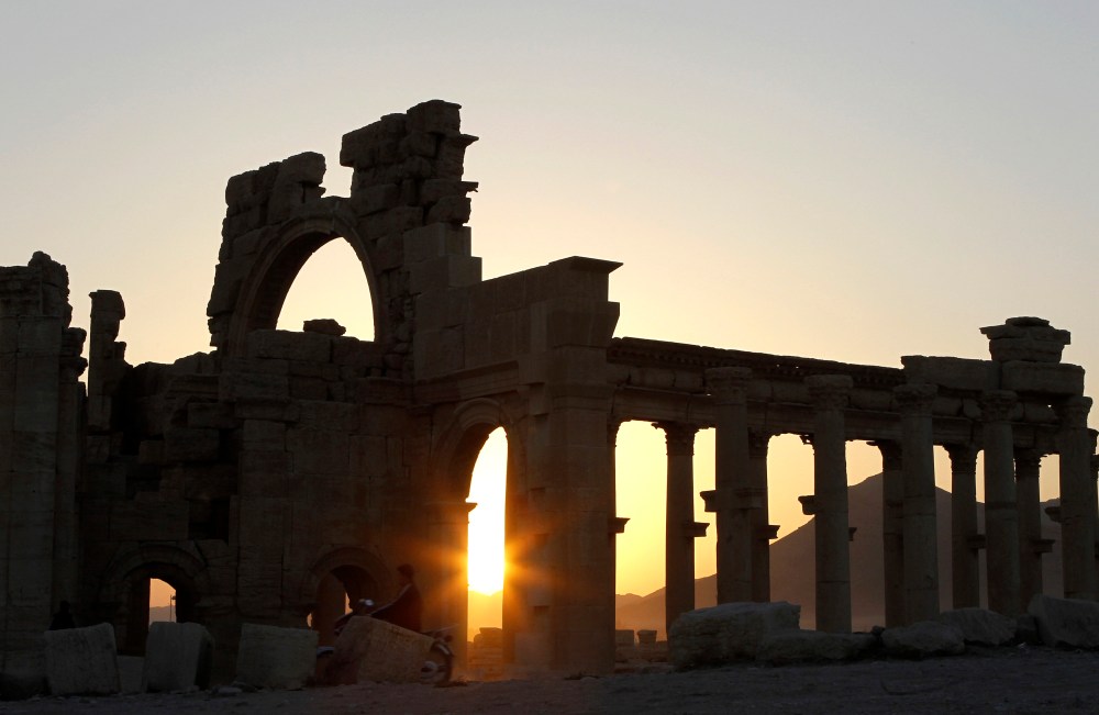 The sun sets behind ruined columns at the historical city of Palmyra, in the Syrian desert, some 240 km (150 miles) northeast the capital of Damascus, Nov. 12, 2010. (Photo by Khaled al-Hariri/Reuters)