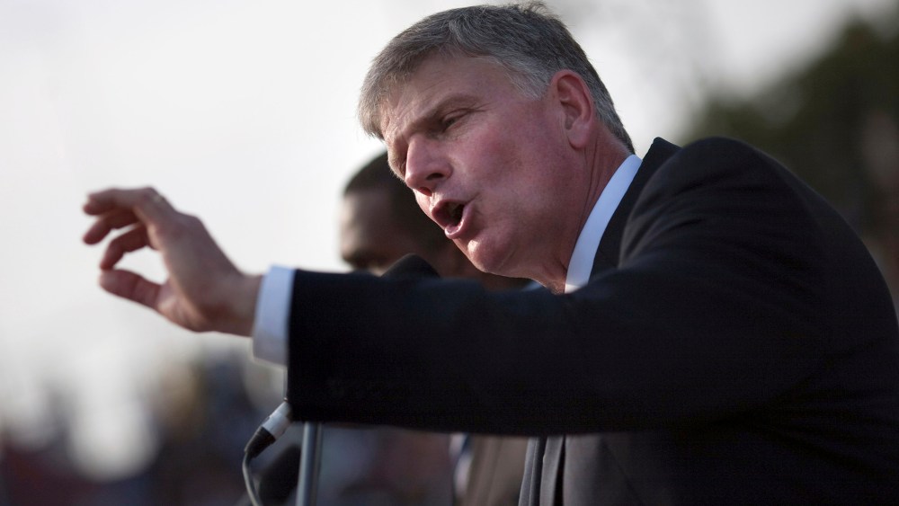 Franklin Graham addresses the crowd at an evangelistic rally  in Port-au-Prince, Jan. 9, 2011. (Photo by Allison Shelley/Reuters)