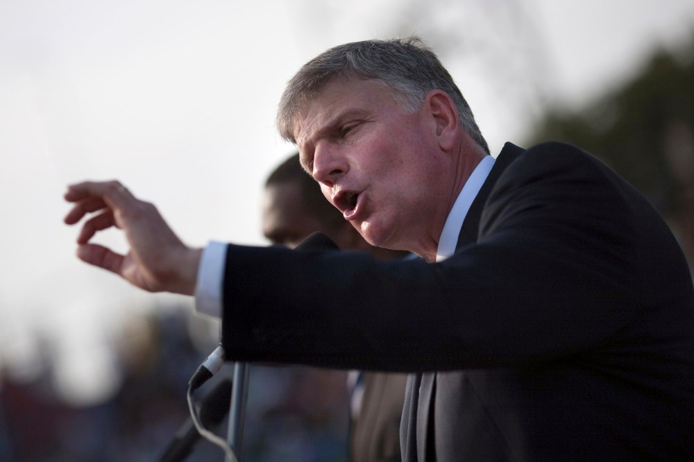 Franklin Graham addresses the crowd at an evangelistic rally in Port-au-Prince, Jan. 9, 2011. (Photo by Allison Shelley/Reuters)