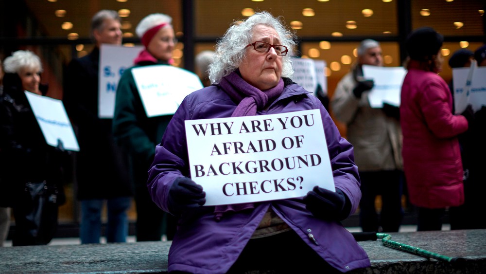 Jerry Delaney listens to speakers during an Organizing for Action rally against gun violence in Chicago, April 13, 2013.
