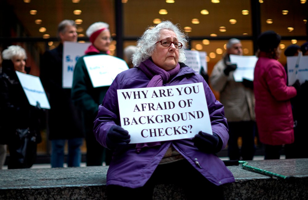 Jerry Delaney listens to speakers during an Organizing for Action rally against gun violence in Chicago, April 13, 2013.