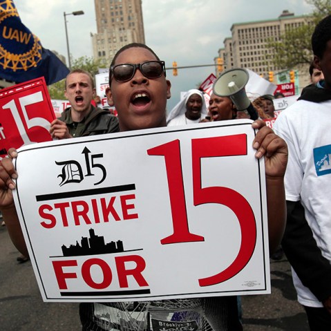A group of workers and labor activists march down West Grand Boulevard as they demand a raise in the minimum wage for fast food workers in Detroit, Michigan May 10, 2013.  (Photo by Rebecca Cook/Reuters)