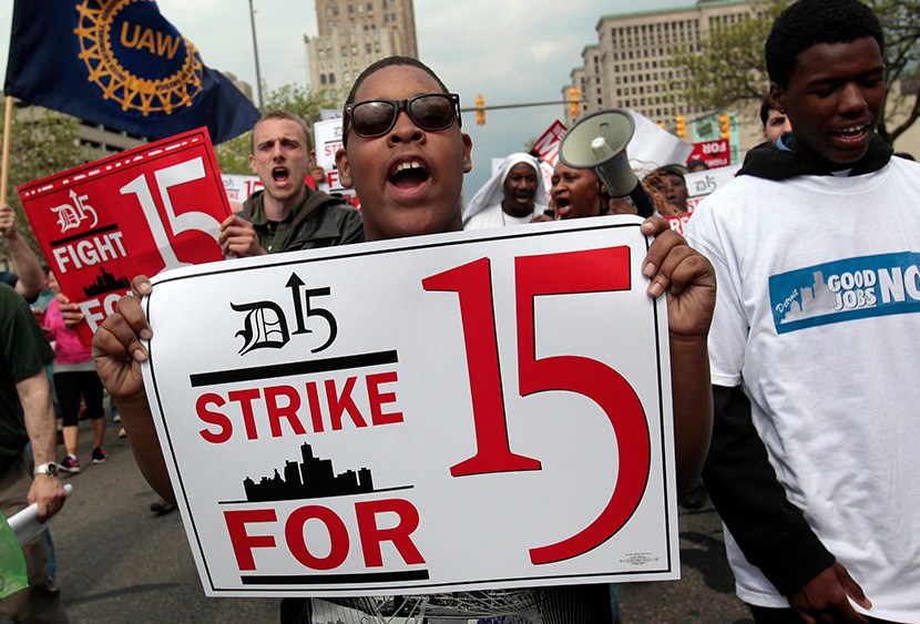 A group of workers and labor activists march down West Grand Boulevard as they demand a raise in the minimum wage for fast food workers in Detroit, Michigan May 10, 2013.  (Photo by Rebecca Cook/Reuters)