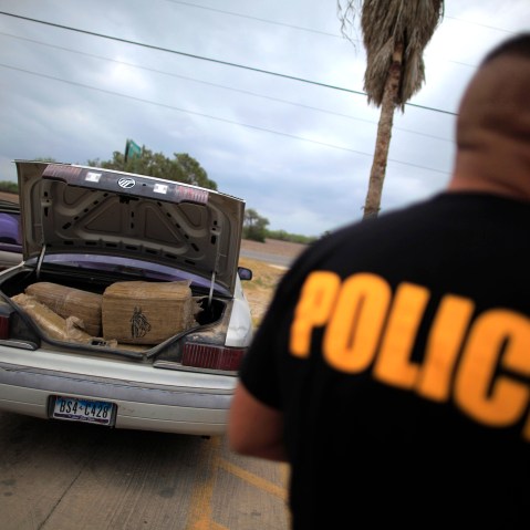 A car filled with bales of marijuana is seen at a police station in La Grulla, Texas