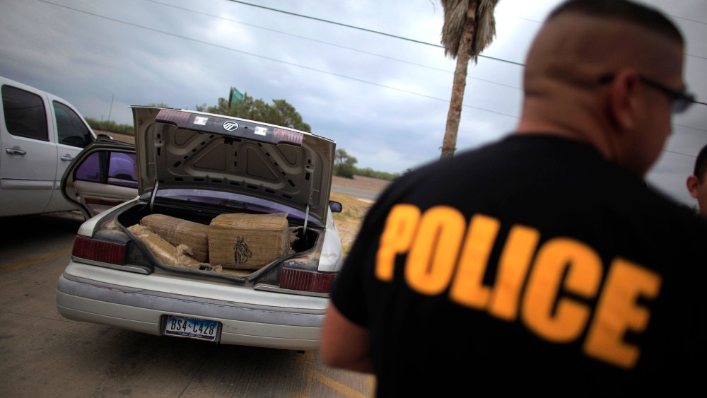 A car filled with bales of marijuana is seen at a police station in La Grulla, Texas
