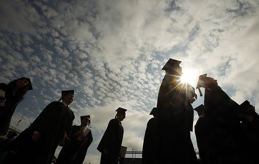 Graduating students arrive for Commencement Exercises at Boston College in Boston, Massachusetts May 20, 2013.  (Photo by Brian Snyder/Reuters)