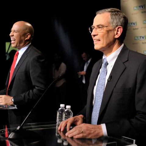 In this photo provided by NJTV, Newark Mayor Cory Booker and Rep. Rush Holt share a laugh before the U.S. Senate Democratic Primary debate televised on NJTV from Montclair State University in Montclair, N.J. on Monday, Aug. 5, 2013. The democratic...