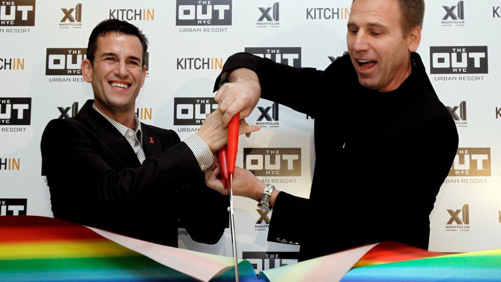 Ian Reisner, left, and Mati Weiderpass, co-owners of The Out NYC hotel, cut the ribbon for New York's new gay resort hotel, March 1, 2012. (Photo by Richard Drew/AP)