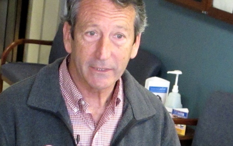 Former South Carolina Gov. Mark Sanford speaks with reporters on Tuesday, March 19, 2013, at a polling place in Charleston, S.C. Sanford, trying to make a political comeback, is one of 16 Republicans running Tuesday in the GOP primary in a special...