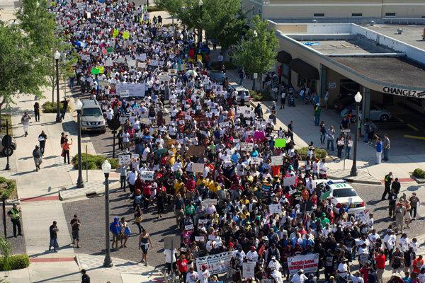 Thousands of people marching through the streets of Sanford, Florida in support of Trayvon Martin on Monday.