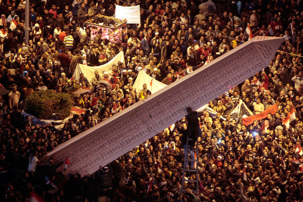 Demonstrators setting up an obelisk in Cairo's Tahir Sqaure on Wednesday. The structure listed names of those who died in the protests.